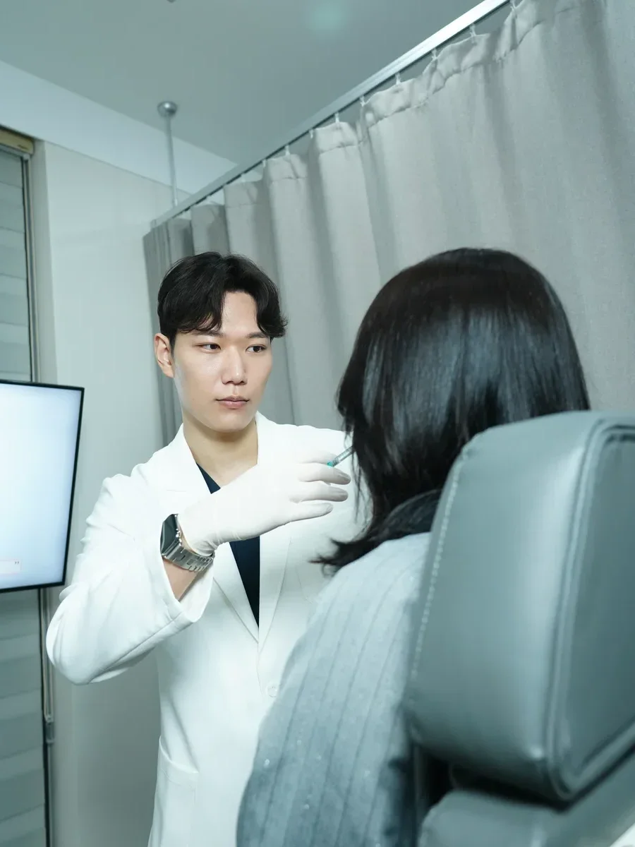Physician performing Juvederm chin filler injection at RE:BERRY Incheon Airport