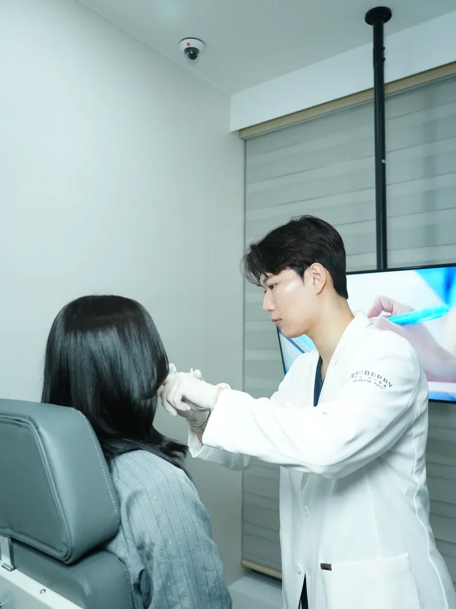 Doctor preparing patient for nasolabial fold filler at RE:BERRY Korea