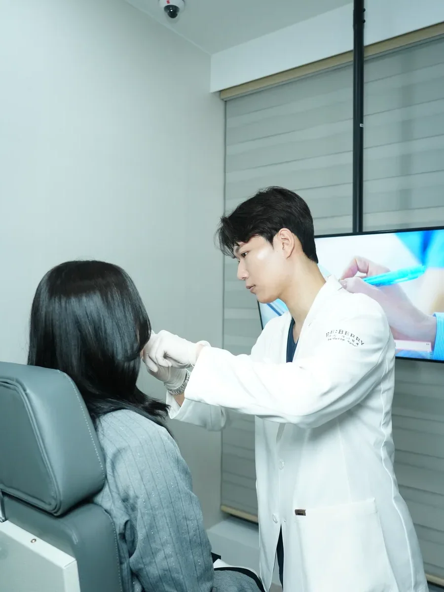 Physician performing precision filler injection